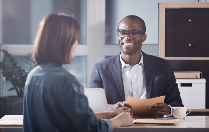 Two people having a productive conflict conversation in an office.