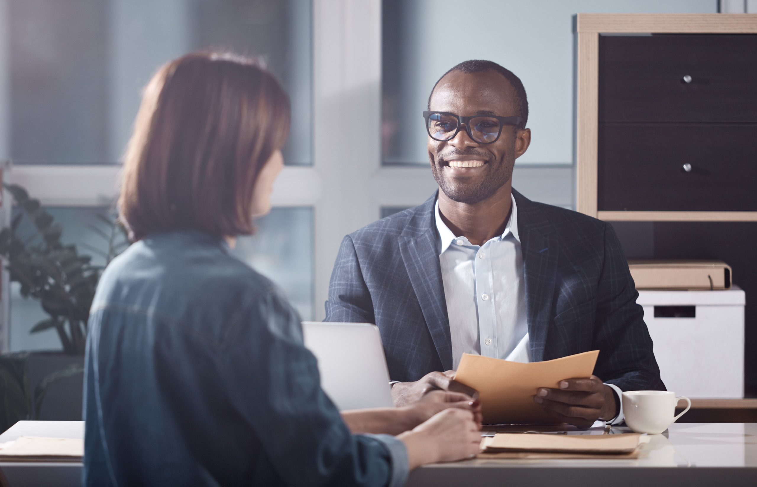 Two people having a productive conflict conversation in an office.